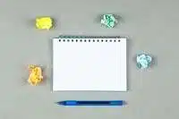 conceptual taking notes with pen notebook torn notes gray background top view space text horizontal image 176474 6778